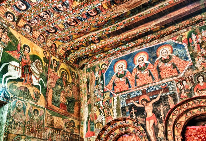 Famous ceiling of Debre Birhan Selassie Church adorned with rows of winged angel faces – 135 cherubs painted in vibrant colors