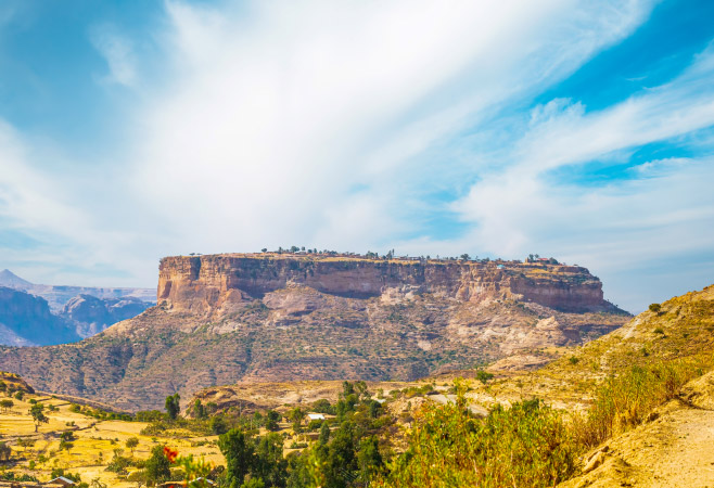 Golden sunrise over the sandstone cliffs where the Debre Damo Monastery is nestled